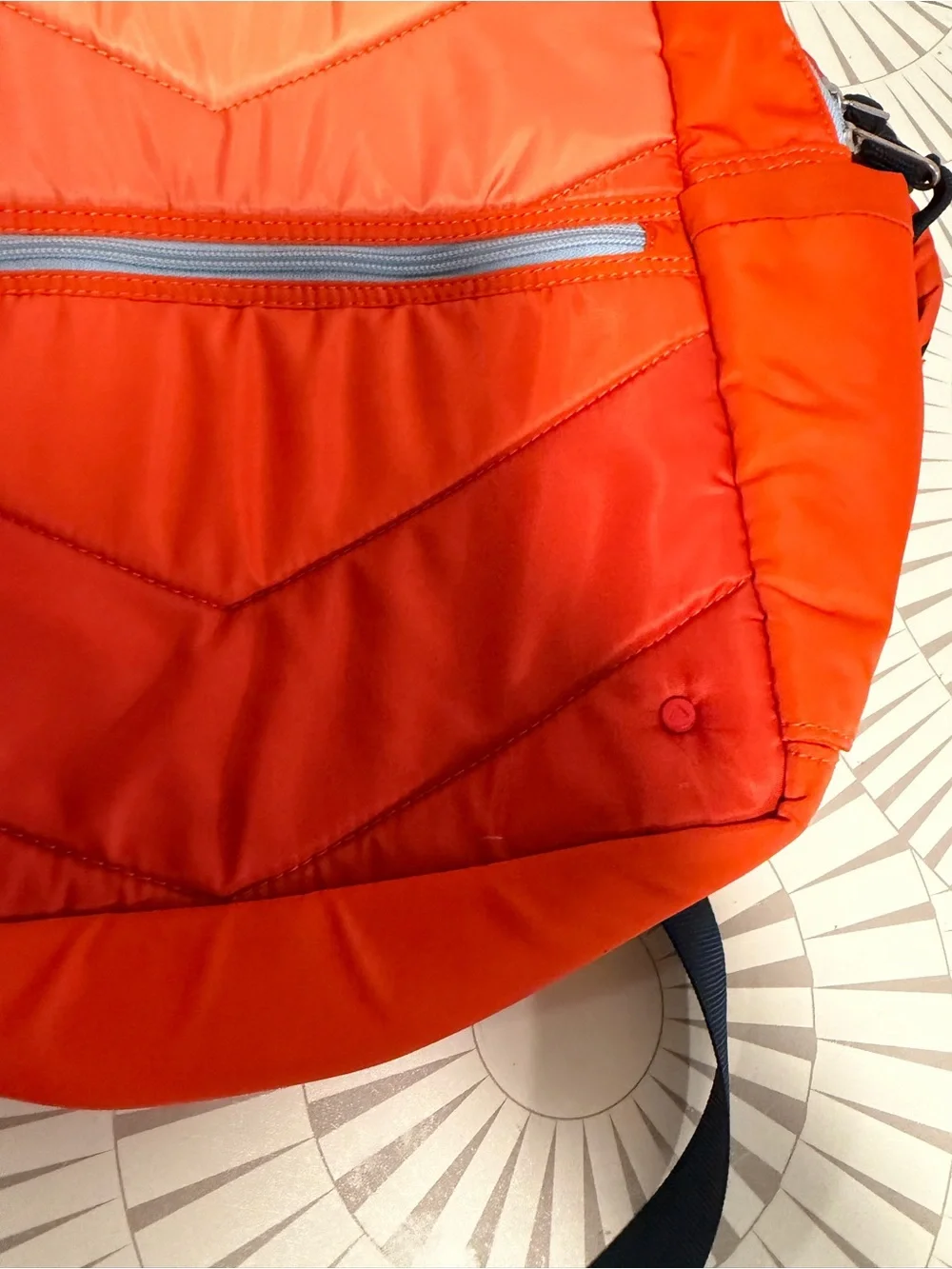 STATE Bags Kane kids backpack in an orange chevron puffer style